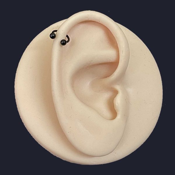 PIERCING BARRA CIRCOLARE NERA CON DUE SFERE