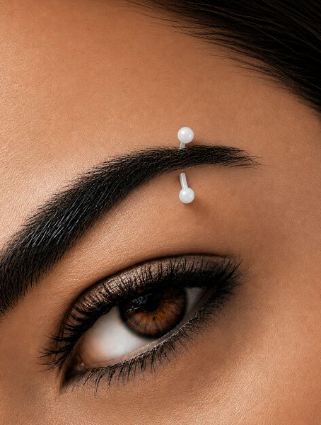 COLORED EYEBROW PIERCING