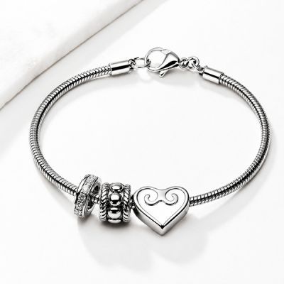 PULSERA CON CORAZÓN Y CHARMS